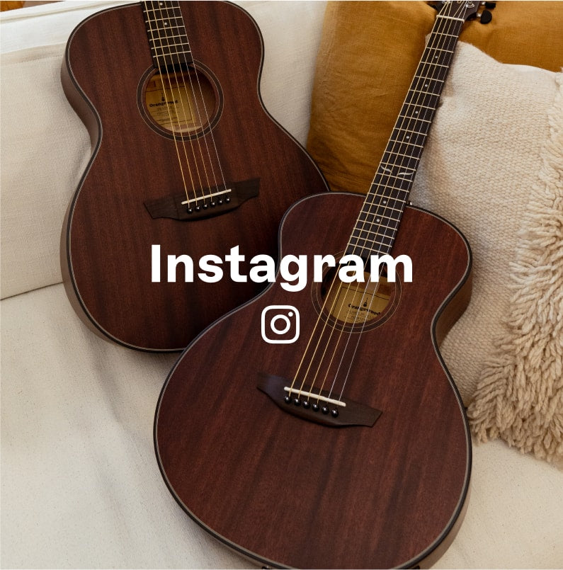 Oliver jr. mahogany and Oliver mahogany guitars on a sofa with Instagram logo overlaid