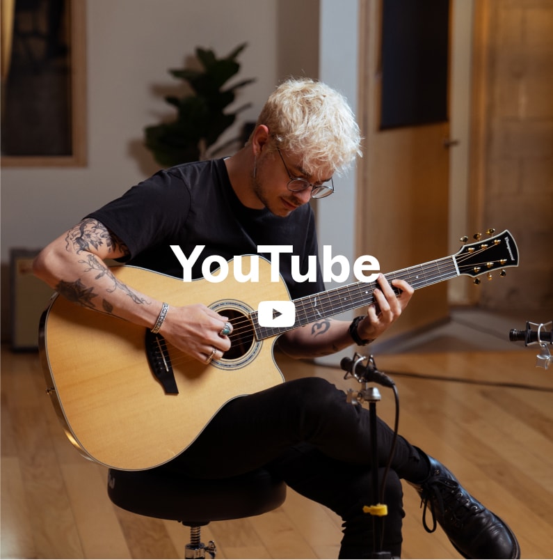 Person playing cleo guitar with youtube logo overlaid